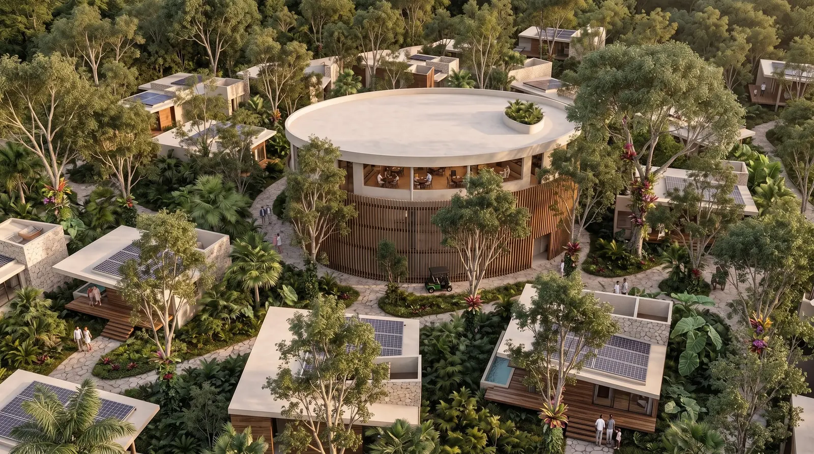 Vista aérea del hotel: nido central circular rodeado de villas entre la selva